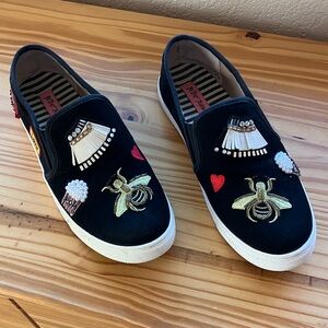 Embellished Black Slip-On Betsey Johnson Sneakers with Gold Bee Detail
